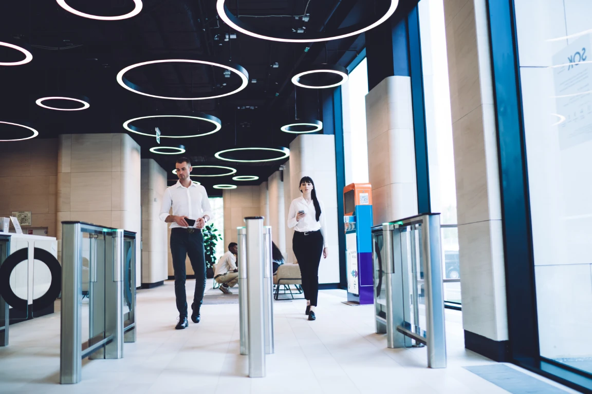 confident coworkers passing checkpoint