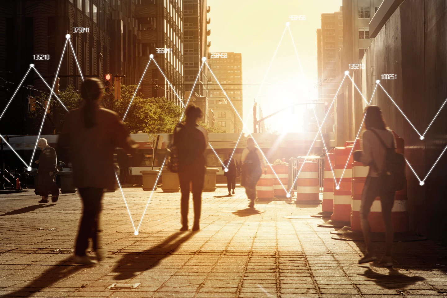 Pedestrians walking along a sunlit city street with overlaid data analytics graphics